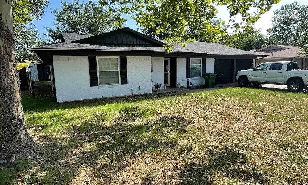 Professional roofing crew working on a residential roof in Liberty Lake